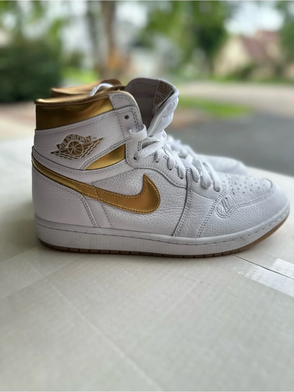 Jordan Women’s High-Top Sneakers — White/Metallic Gold